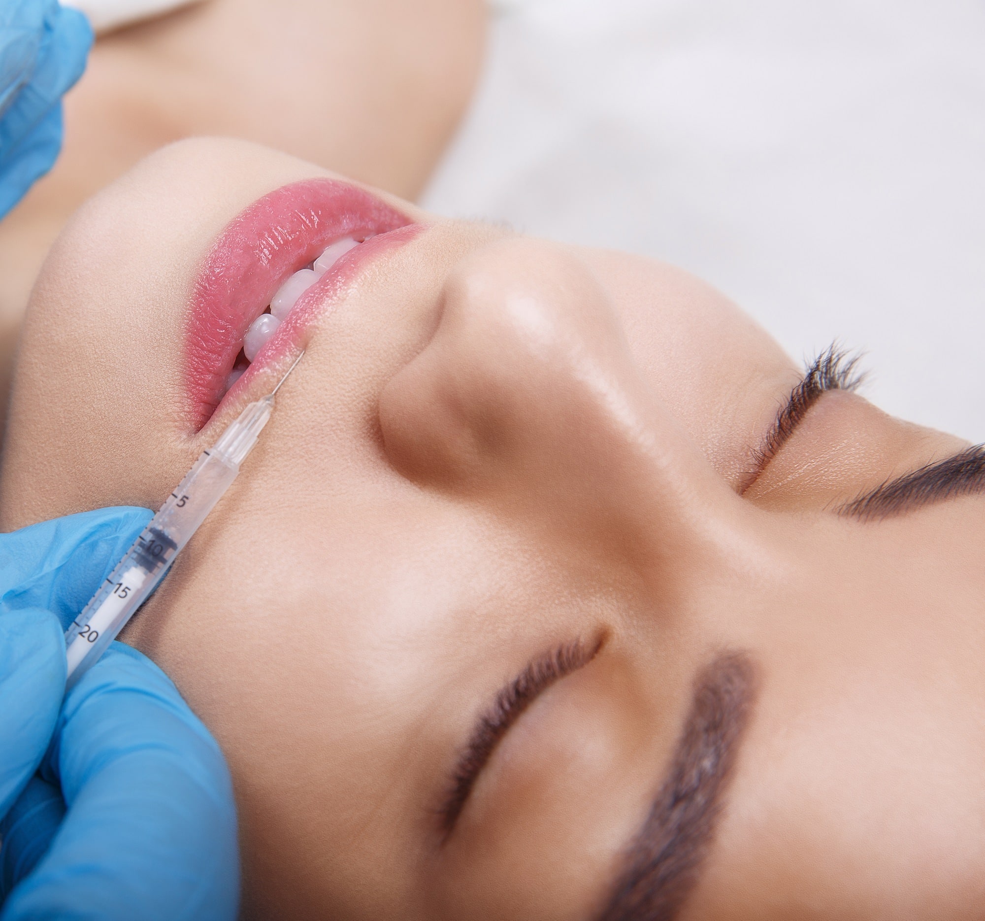 A woman receiving dermal filler treatment at the Sin Emporium clinic in Clapham, London.